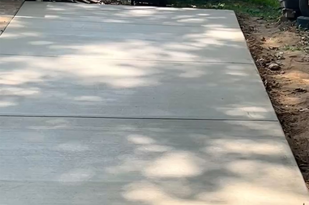 Finished concrete driveway addition in Athens Michigan by Marc Todd Concrete