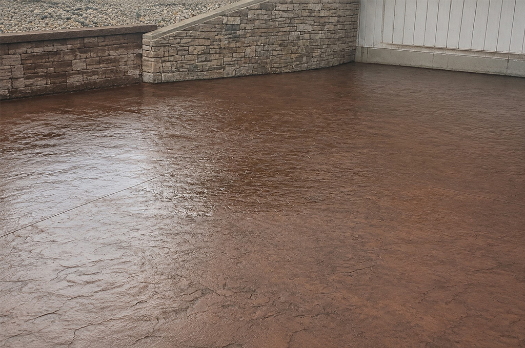 Concrete retaining wall and stamped concrete patio in Auburn Indiana by Marc Todd Concrete