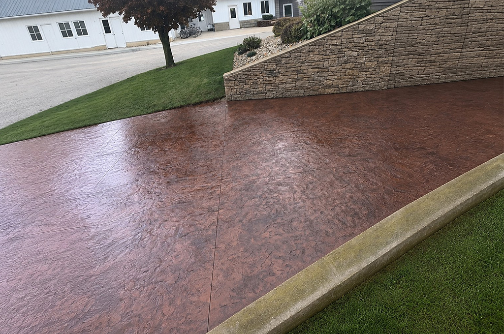 Stamped concrete patio with concrete retaining wall in Auburn Indiana by Marc Todd Concrete