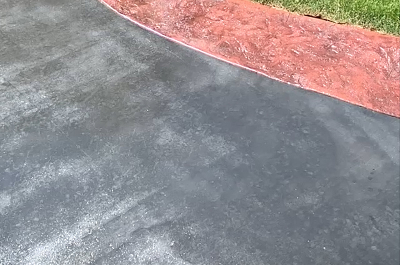 Gull gray colored concrete with a stamped border in Battle Creek, Michigan