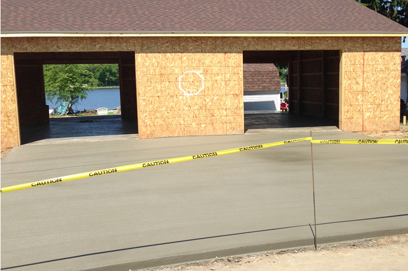 Two-car concrete garage floor and approach completed in Bronson Michigan by Marc Todd Concrete