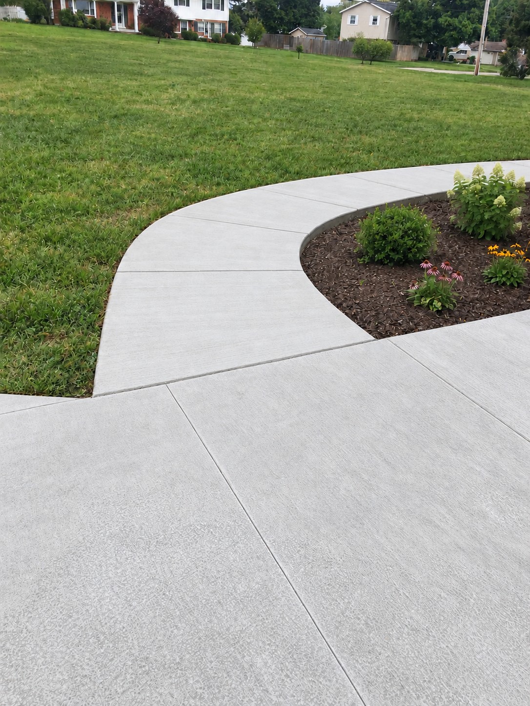 Curved concrete sidewalk and driveway at Diamond Lake in Cassopolis, Michigan