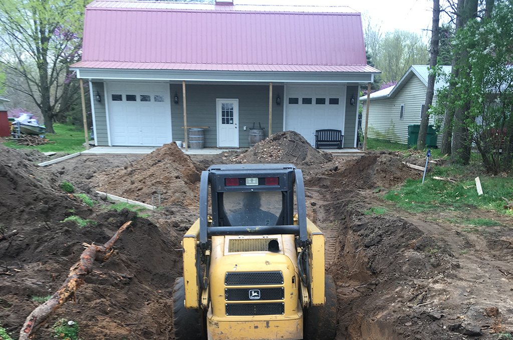 Completed site and subgrade preparation for a concrete driveway in Colon Michigan