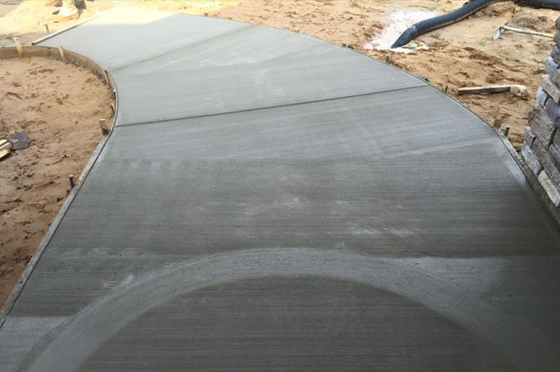 Rounded custom concrete step and sidewalk in Fremont, Indiana