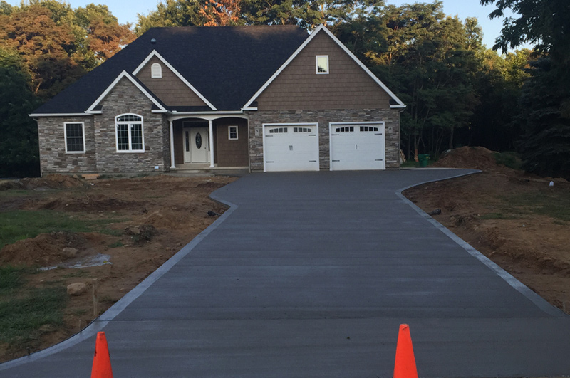 Colored concrete driveway and parking area for a new home in Goshen, Indiana