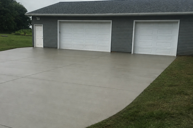 Concrete driveway, garage floor and connecting sidewalk installed near Goshen, Indiana