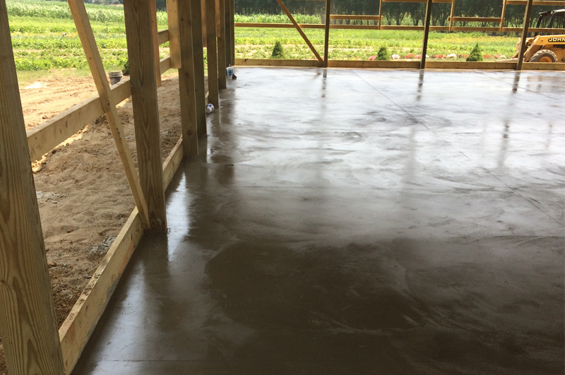 Concrete pole barn floor apron and connecting sidewalk in Howe Indiana