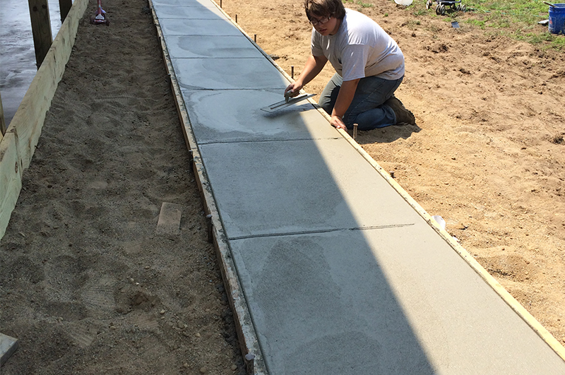 Concrete sidewalk installed by Marc Todd Concrete in Howe Indiana