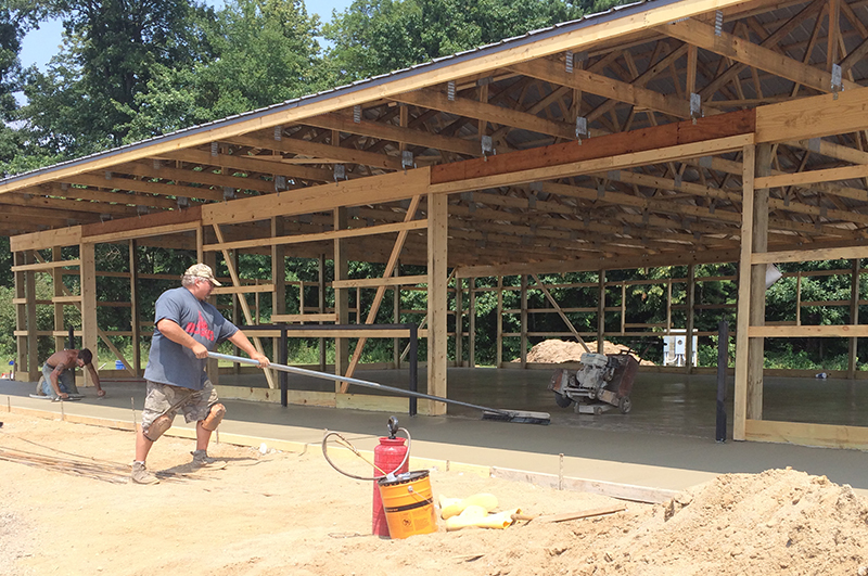 Completed agricultural concrete floor apron and sidewalk at a Howe Indiana fruit farm