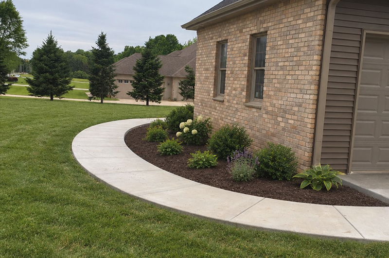 Curved concrete sidewalk completed in Jones, Michigan by Marc Todd Concrete