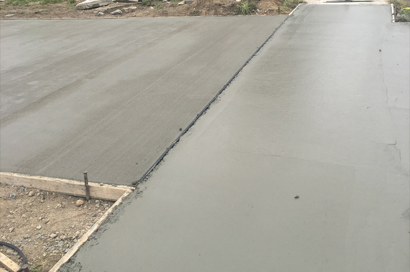 Concrete driveway and connecting sidewalk in Jones, Michigan by Marc Todd Concrete