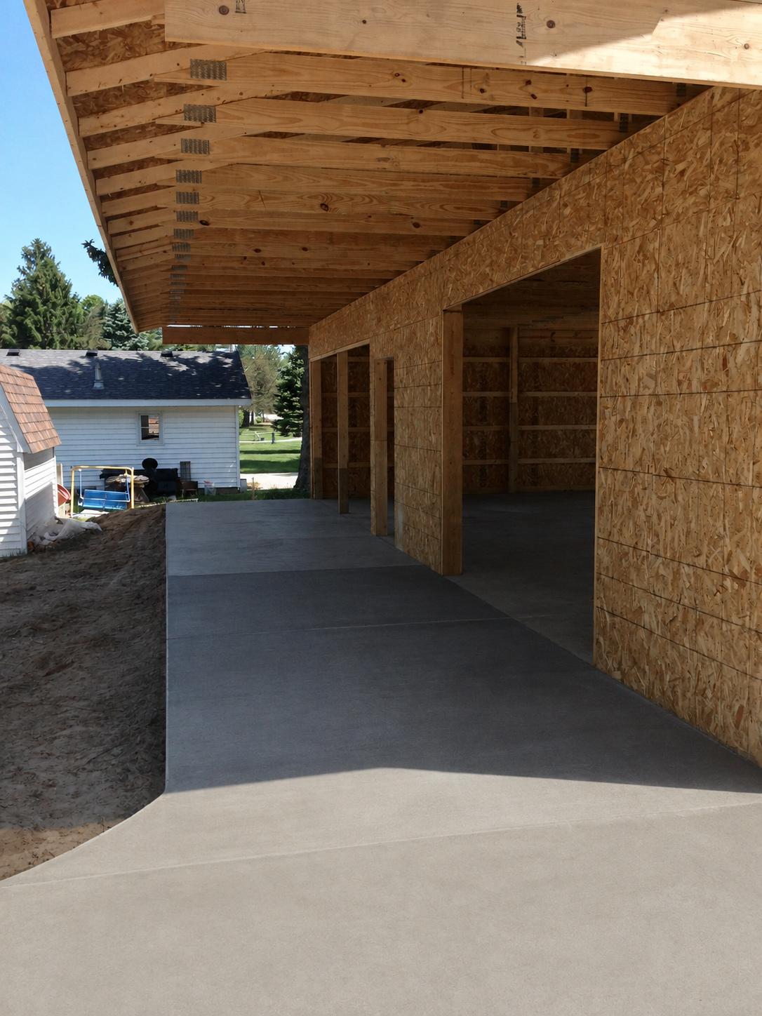 Two-car garage floor and adjoining concrete slab in Ligonier, Indiana