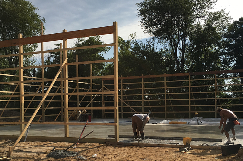Concrete being poured for a pole barn floor in Mendon Michigan