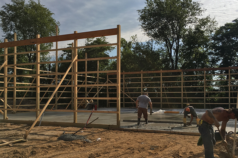 Marc Todd Concrete crew pouring a concrete pole barn floor in Mendon Michigan