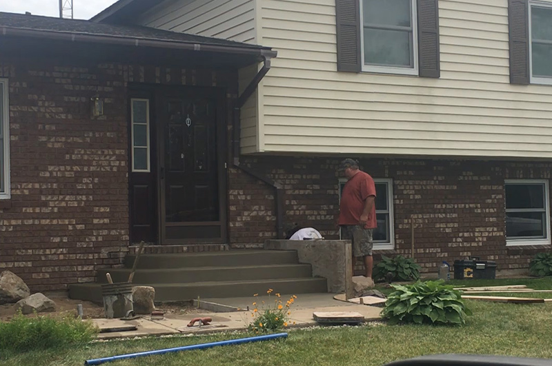 Custom rounded concrete steps at a home entrance in Millersburg, Indiana