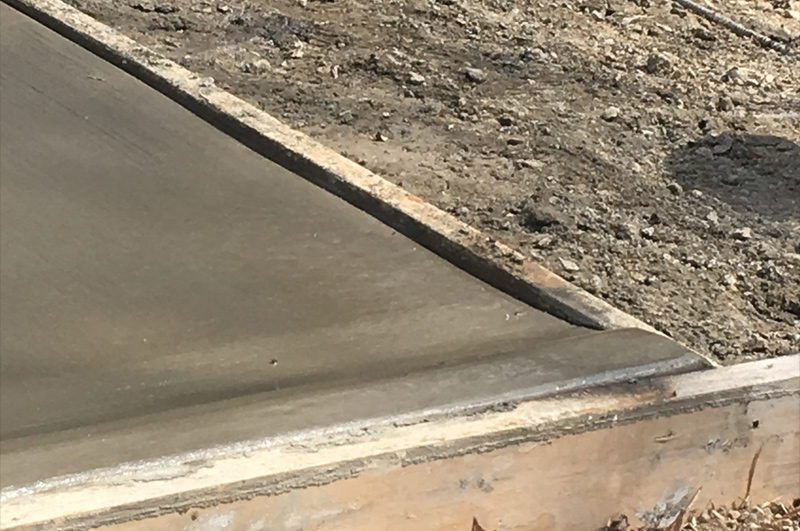 Concrete driveway with custom curbed edging in Millersburg, Indiana