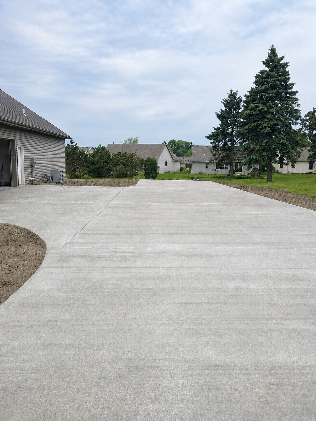 New concrete driveway installed at a residential home in Niles Michigan
