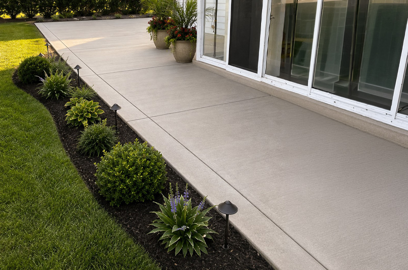 Concrete patio and porch area with French drain in Portage, Michigan