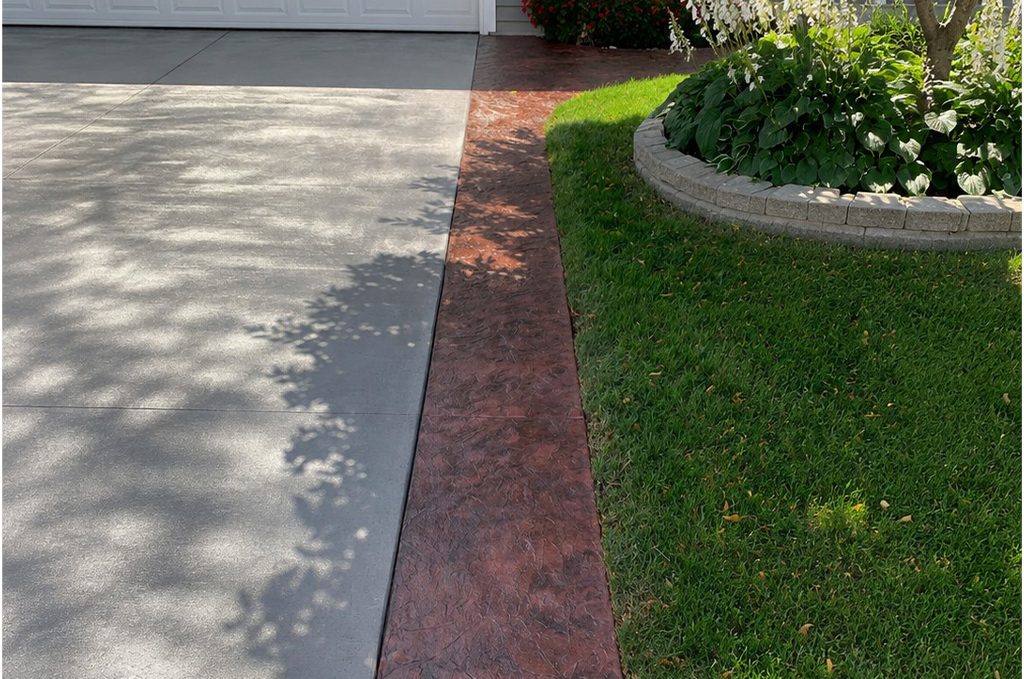 Colored concrete with stamped border in Sturgis Michigan by Marc Todd Concrete