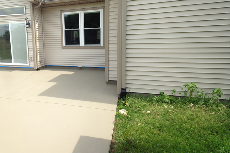 Large colored concrete patio and rounded step in Vicksburg, Michigan