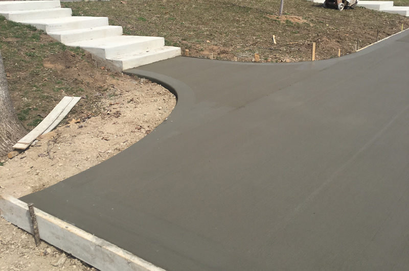 Concrete driveway and custom steps poured in Waterloo Indiana by Marc Todd Concrete