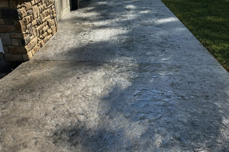 Stamped and colored patio and custom steps poured in Waterloo Indiana by Marc Todd Concrete