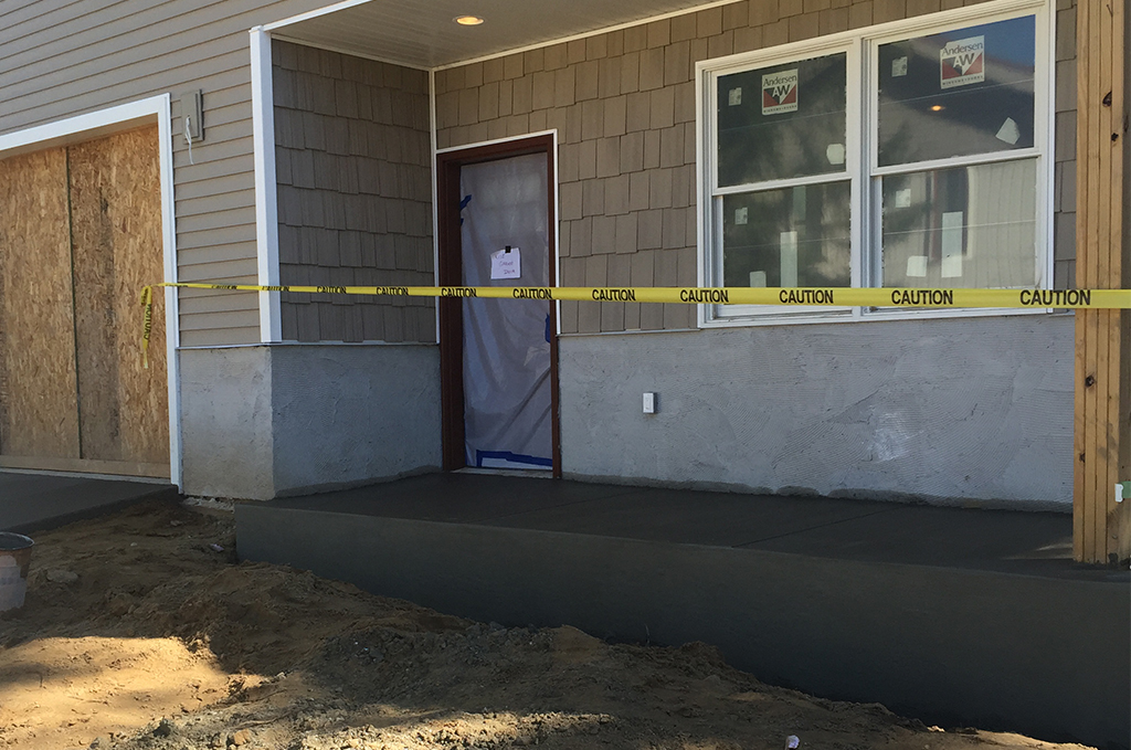 Custom concrete front porch at a Klinger Lake cottage near White Pigeon Michigan