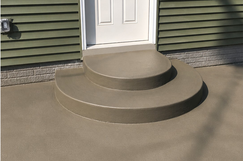 Custom oval concrete front steps at a Klinger Lake home near White Pigeon Michigan