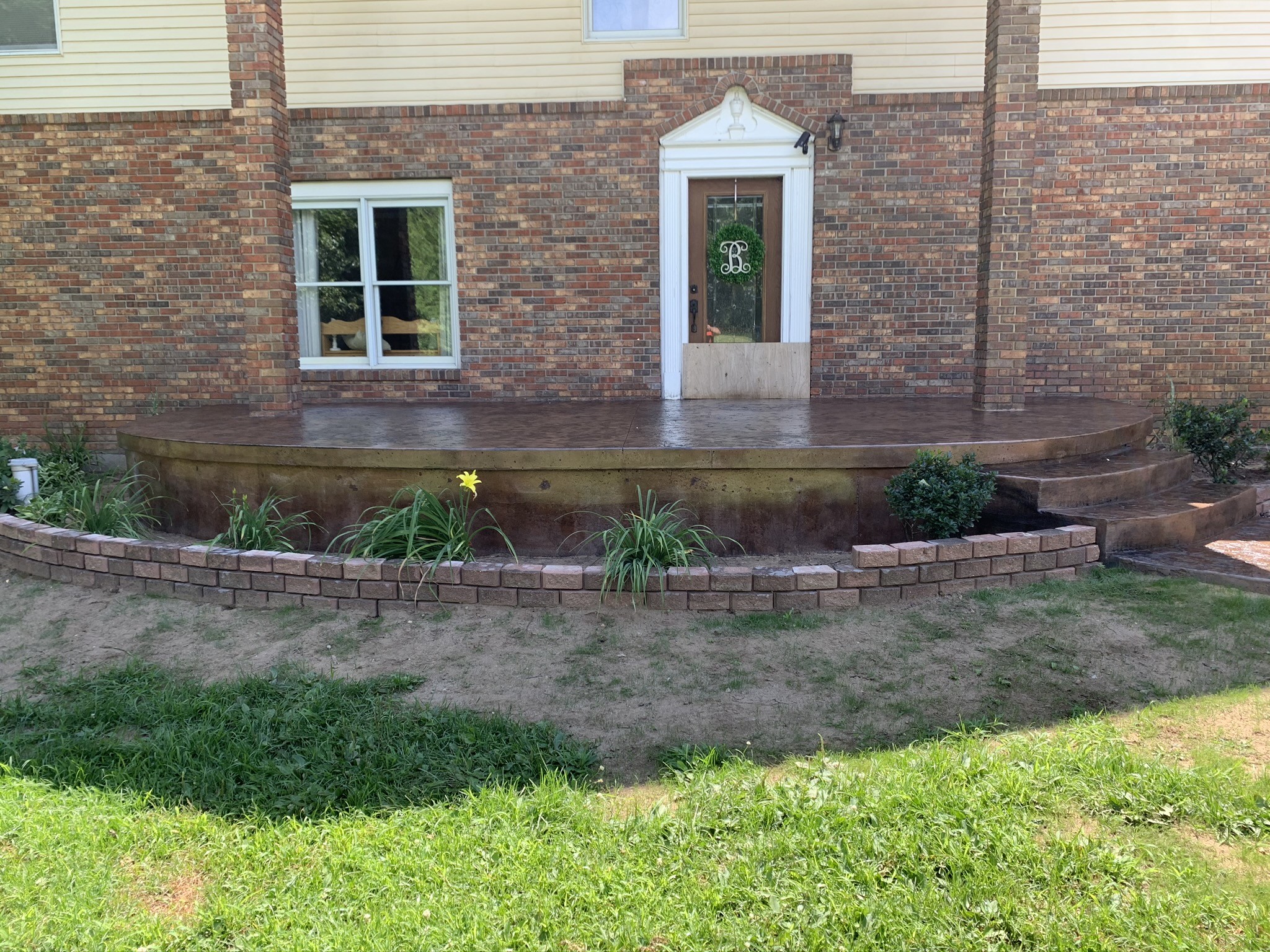 Wide view of a custom stamped concrete patio in Three Rivers, Michigan