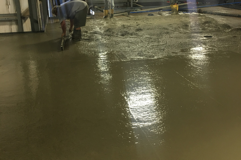 Second-story lightweight concrete floor progressing toward a uniform finished surface