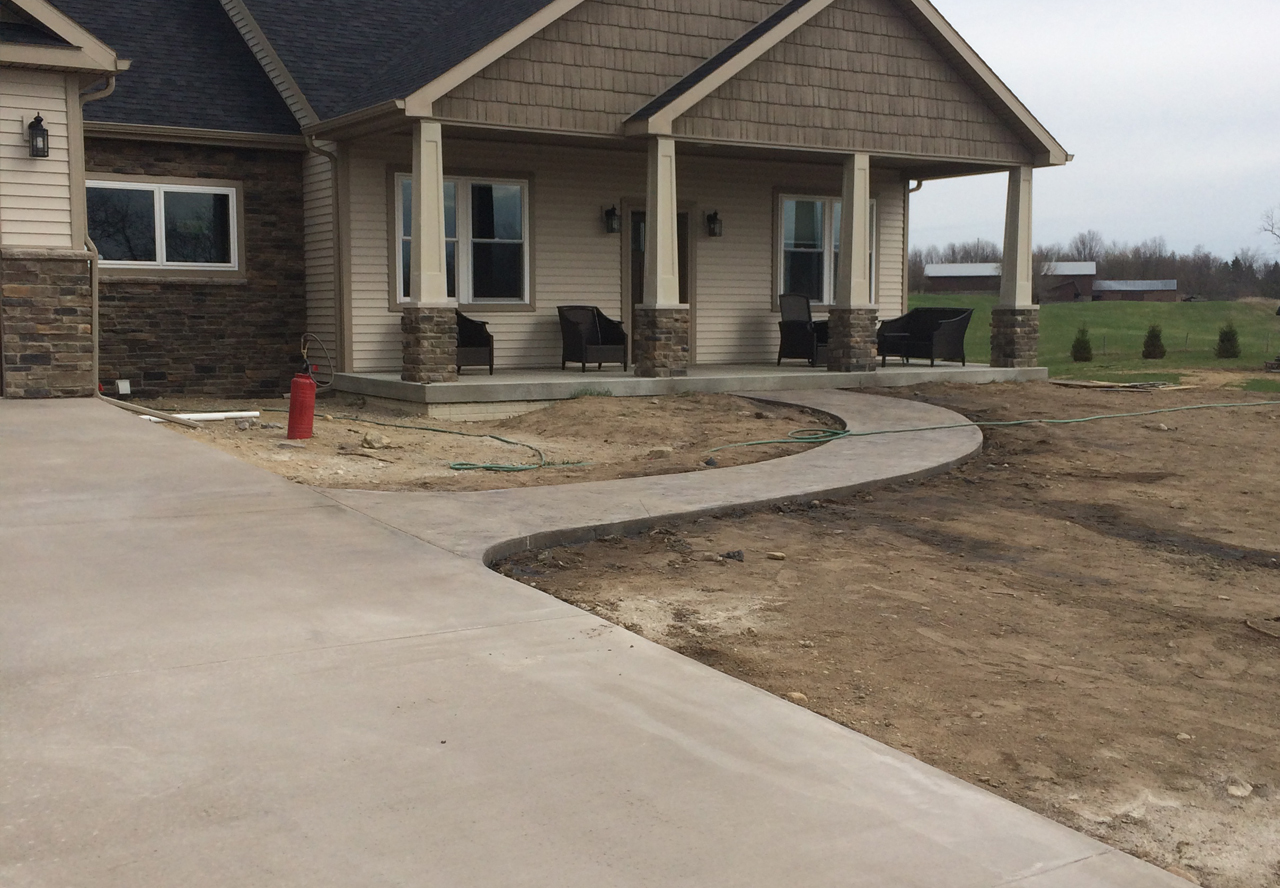 Finished colored concrete driveway project by Marc Todd Concrete
