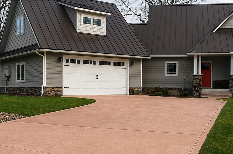 Driveway with colored concrete by Marc Todd Concrete