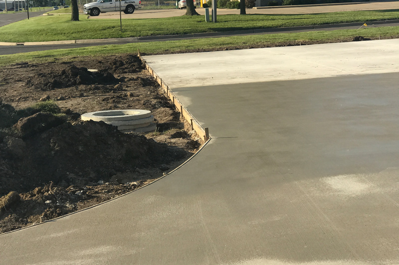 Commercial concrete parking lot with water-detention basin for GT Independence in Sturgis Michigan