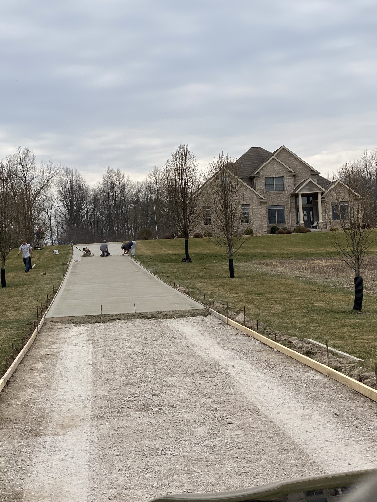 Marc Todd Concrete crew finishing a large concrete driveway in Lakeville Indiana
