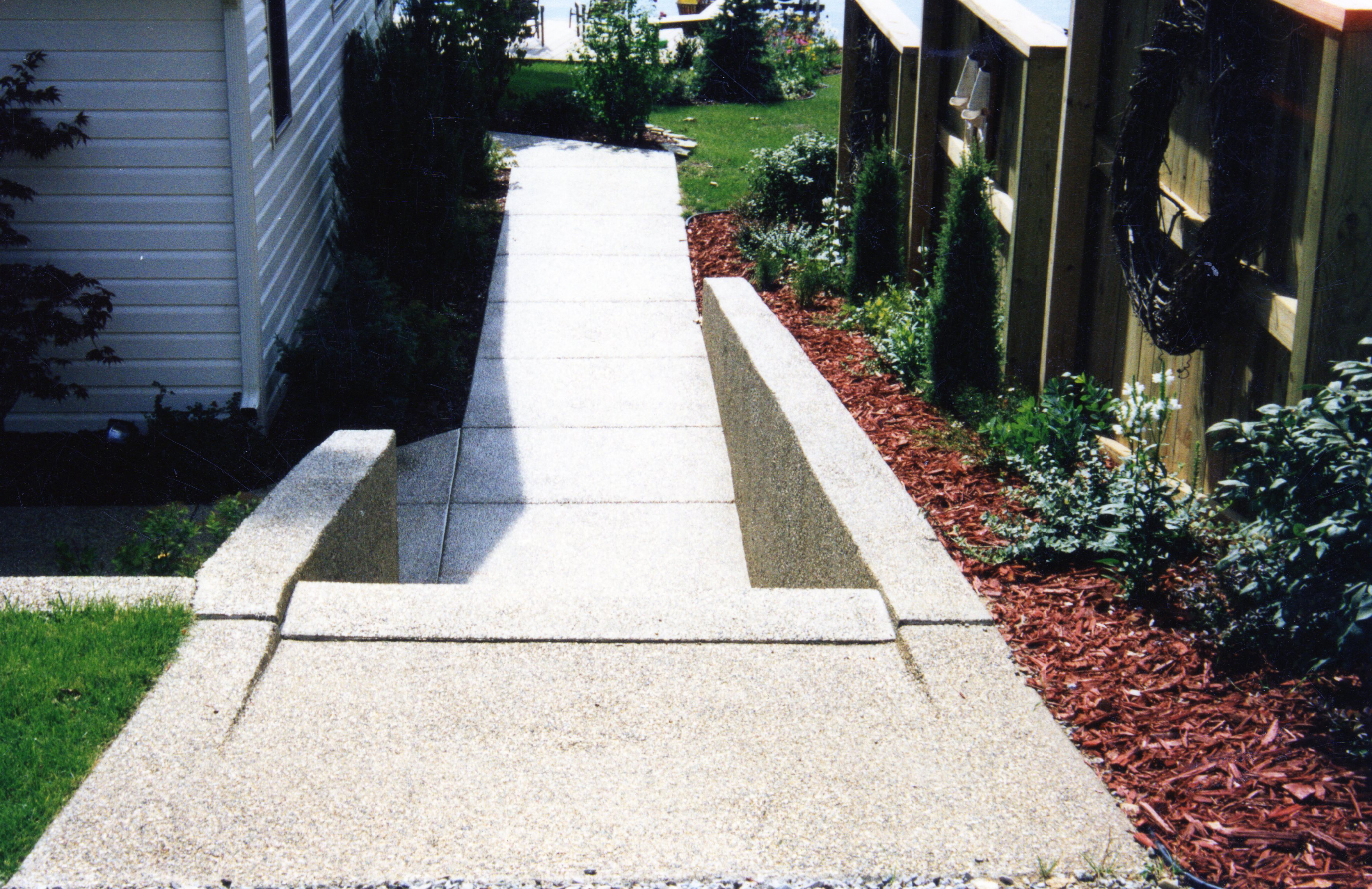Exposed aggregate concrete hardscape at Omena Lake in Sturgis Michigan