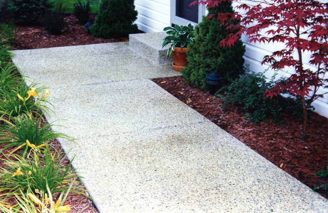 Exposed aggregate sidewalk beside Omena Lake in Sturgis Michigan